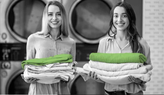 People holding freshly cleaned clothes